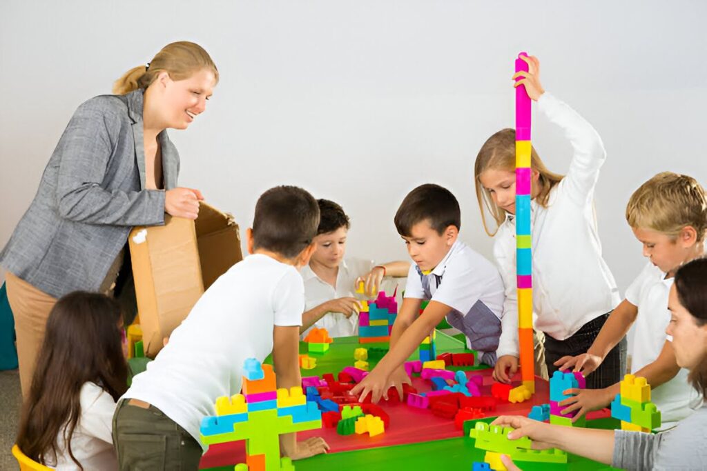 A childcare specialist playing with kids at a corporate event